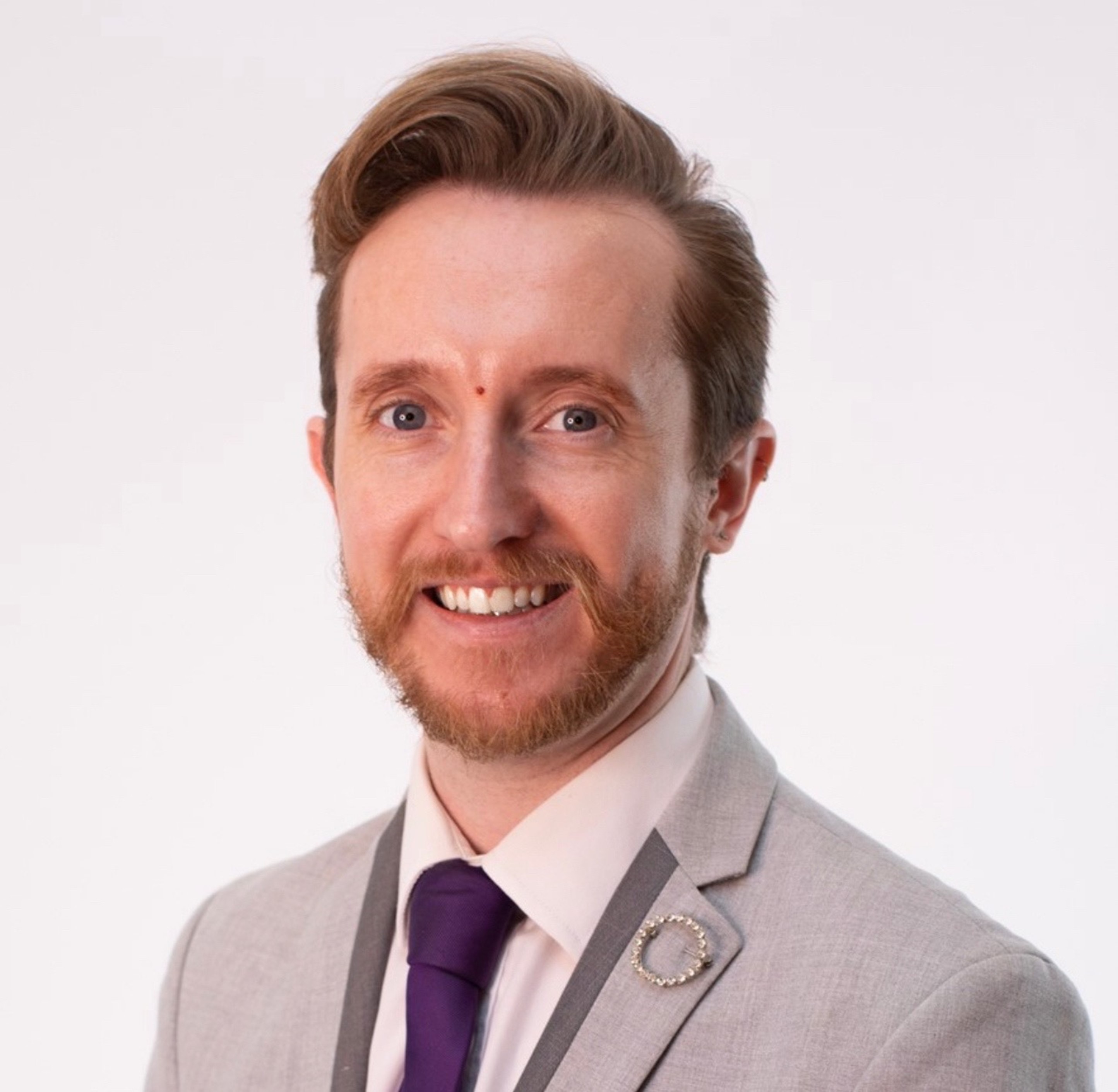 Headshot of Aaron Boasman-Patel