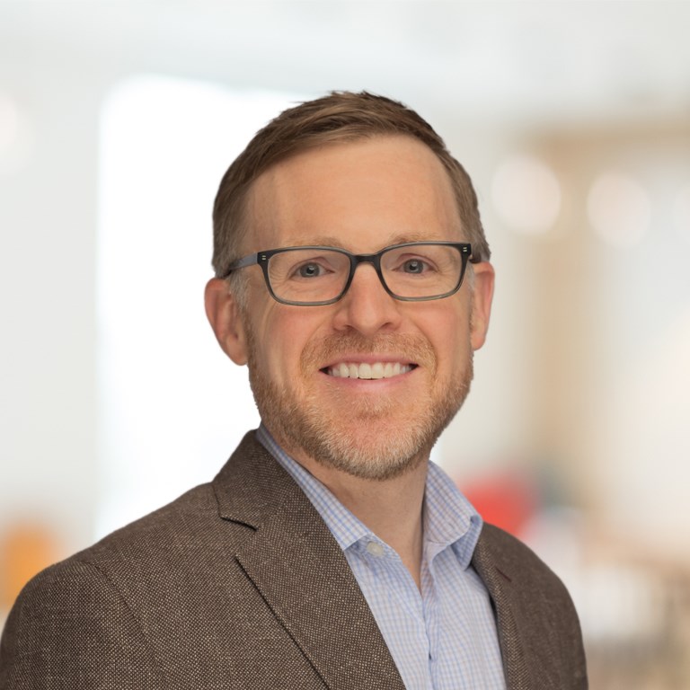 Headshot of Adam Cox