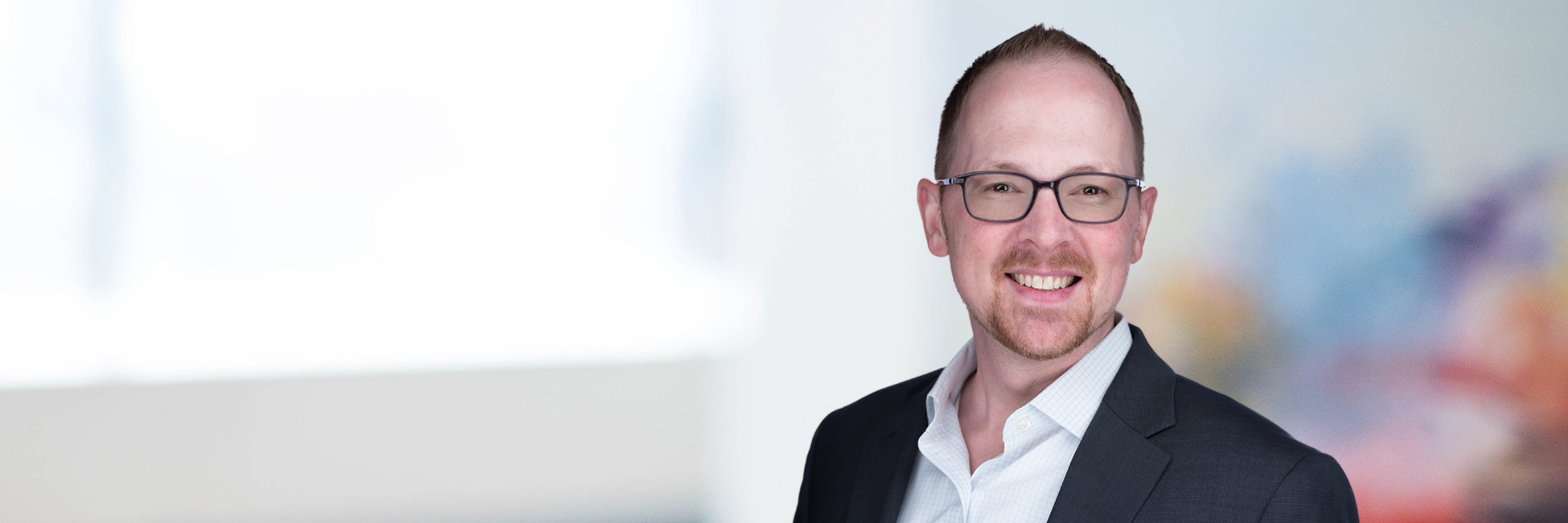 Headshot of Travis Wibracht