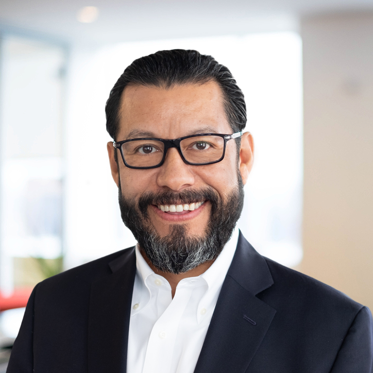 Headshot of Lou Madge