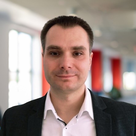 Headshot of Tomasz Chodakowski